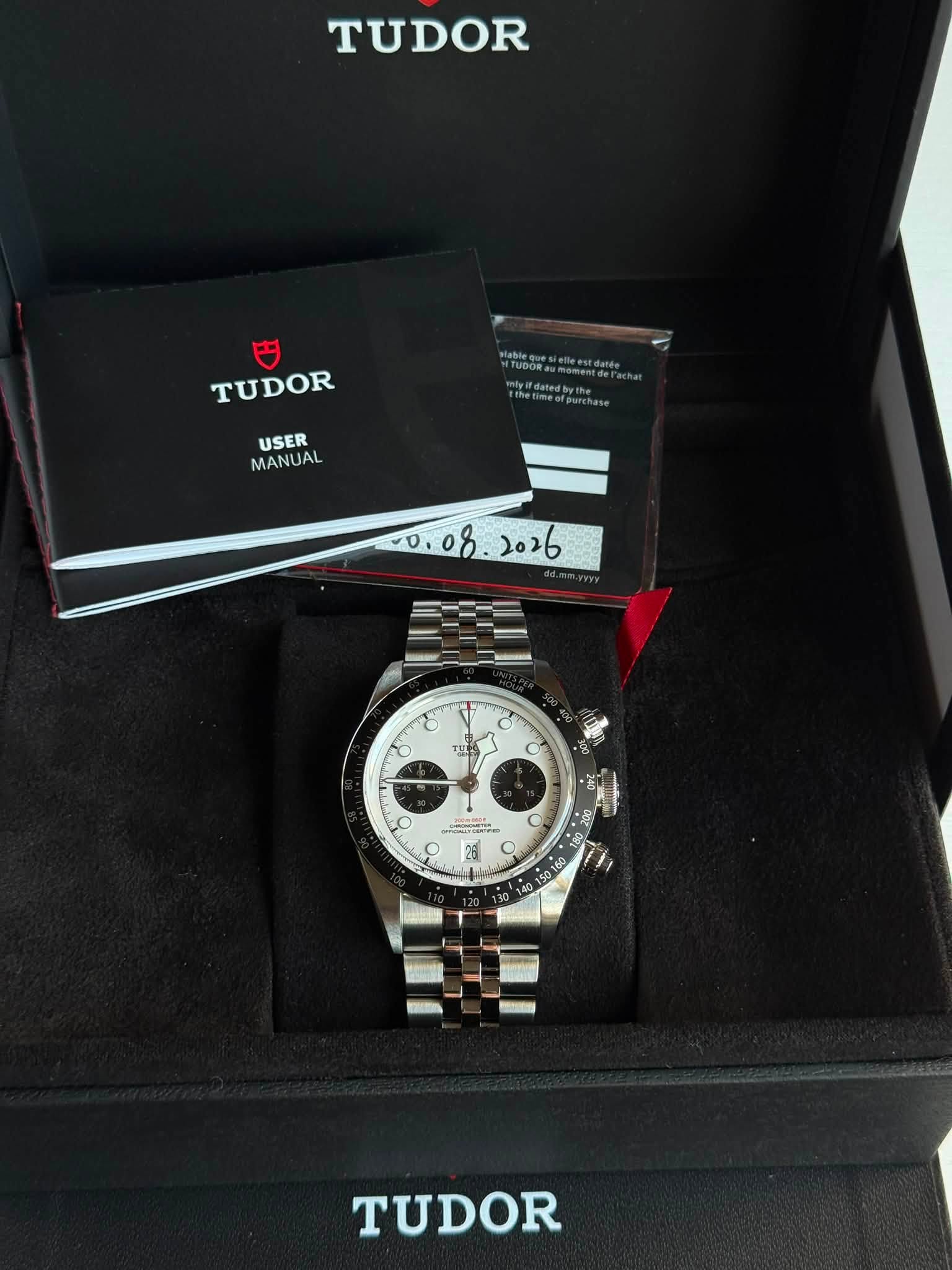 May be an image of wrist watch and text