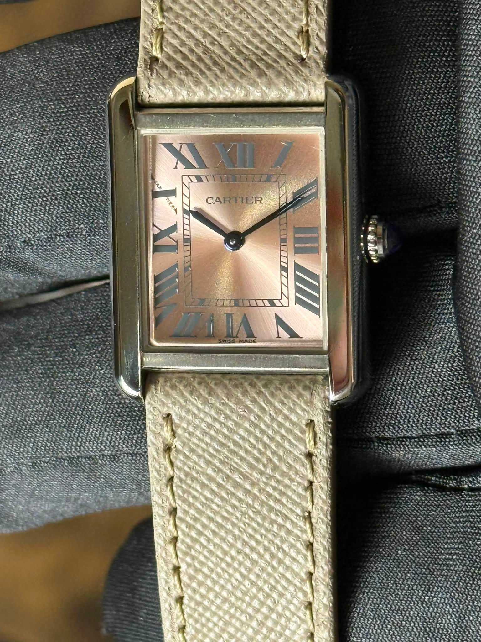 May be an image of wrist watch and text