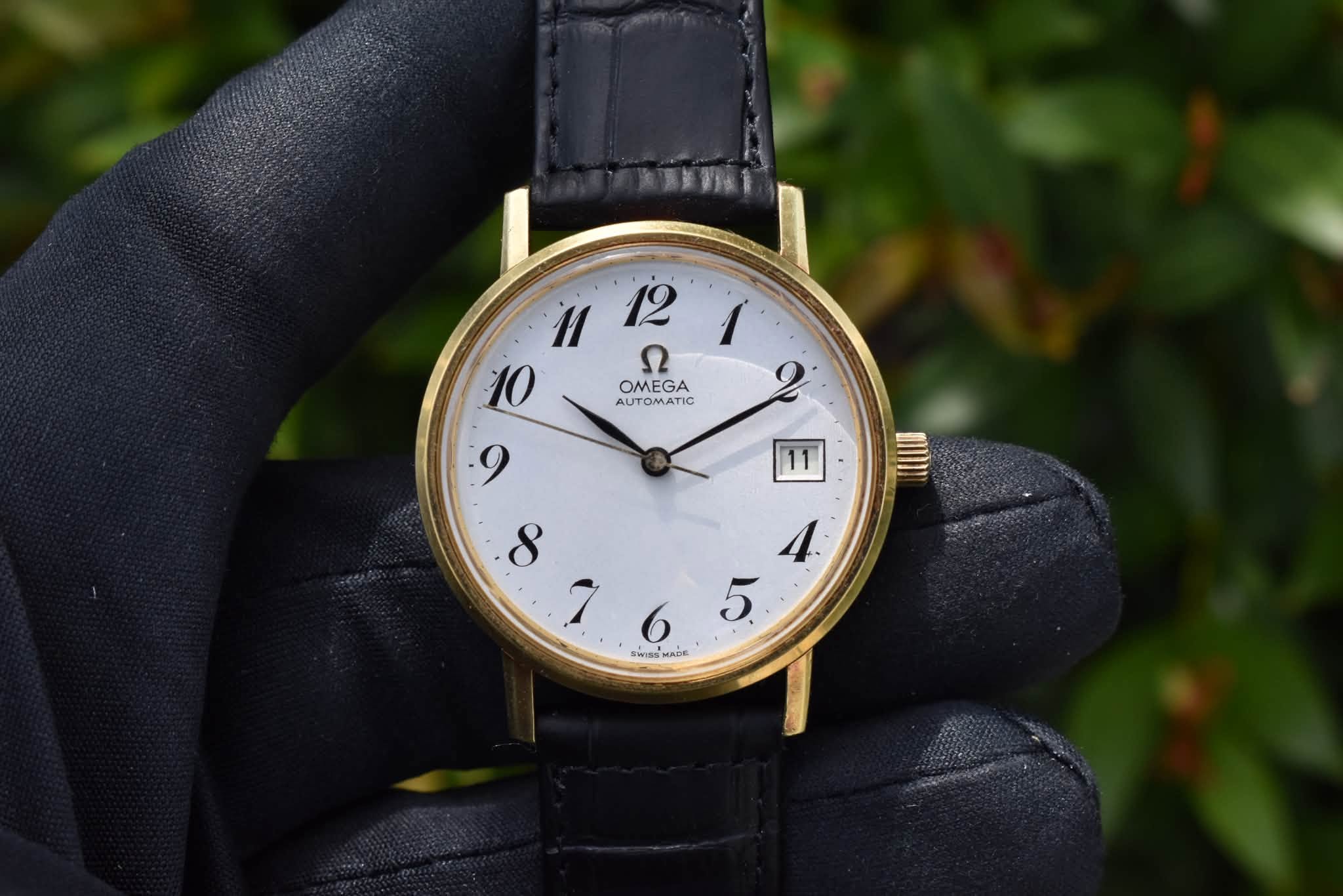 May be an image of wrist watch and text that says 'u 12 n112r 1 10 ဂ 2 OMEGA AUTOMATIC SwSS BNISSMADE MADE 11 4. 5'