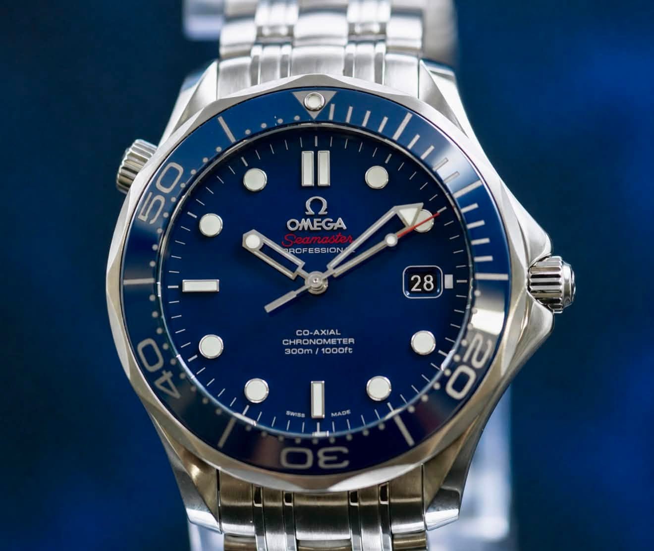May be an image of wrist watch and text that says '50 0 Il 7 OMEGA BROF ROFESSION 28 28 CO-AXIAL cO O-AXIAL CHRONOMETER CH CHRON CHRONOMETE BONOMETER 300m 1000ft SWISS I 00 fU'