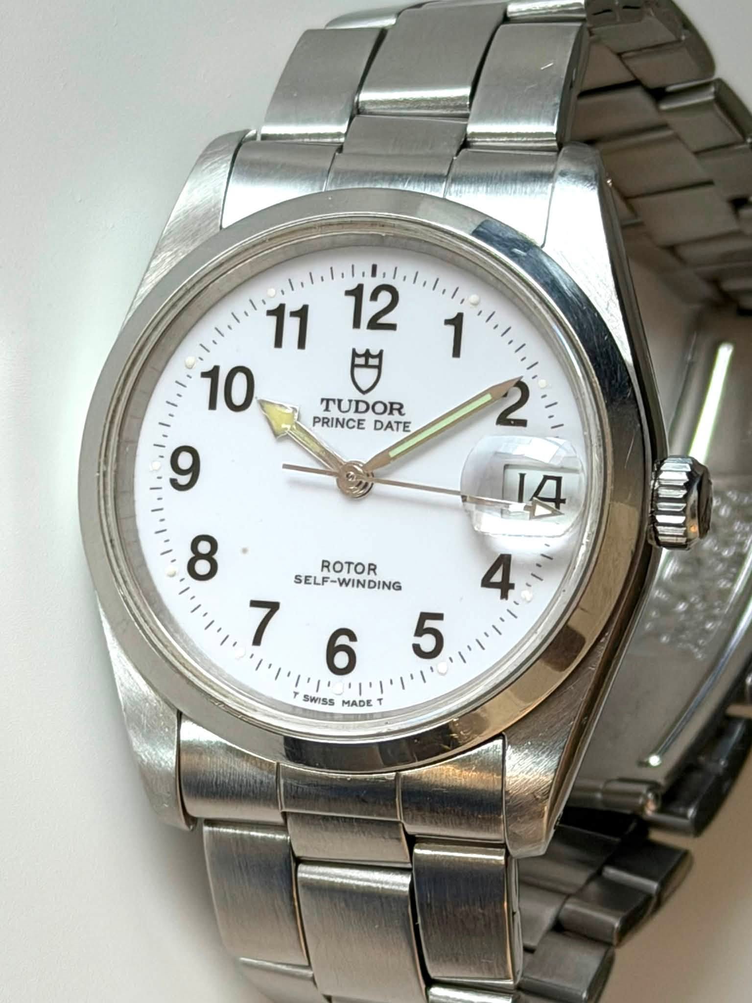 May be an image of wrist watch and text that says '11 12 10 色 TUDOR PRINCE DATE 9 1 2 A 4 5 ' 8 ROTOR SELF-WINDING WINDING SELP 7 6 SWISS MADE'