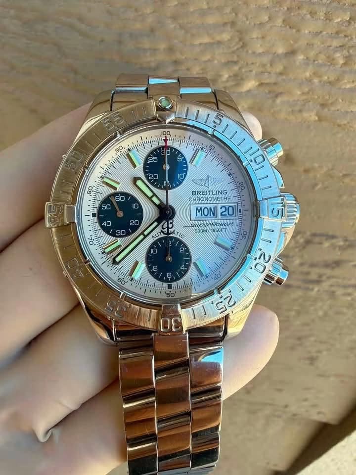 May be an image of wrist watch and text