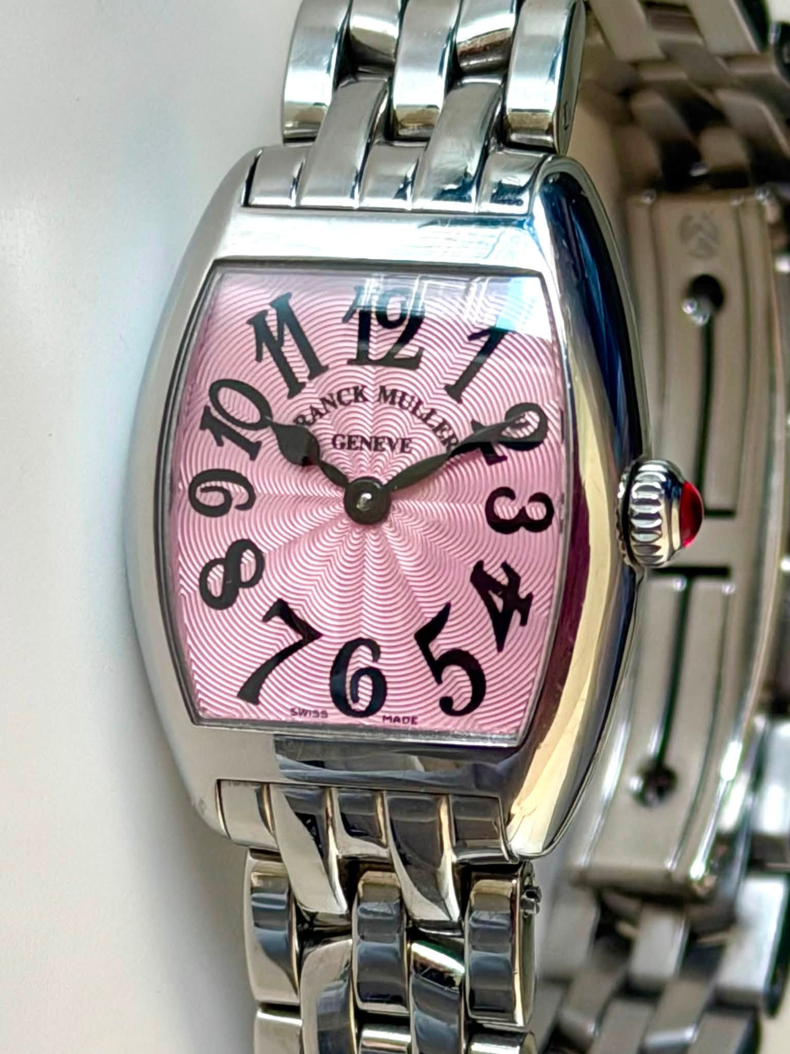 May be an image of wrist watch and text