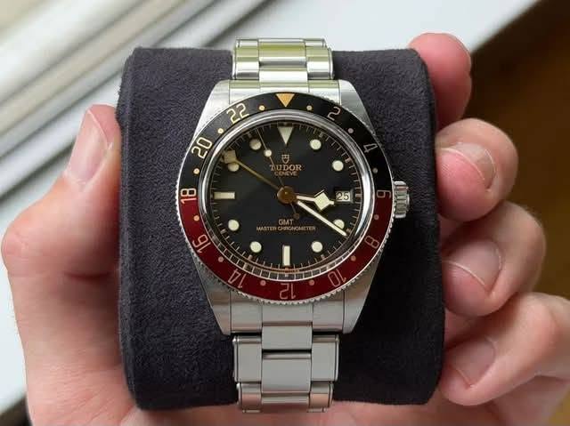 May be an image of wrist watch and text