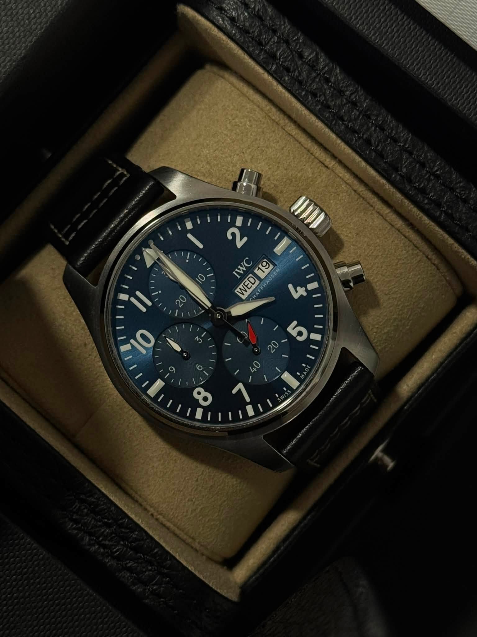 May be an image of wrist watch and text that says 'UIDD 2 IWC 19 WED EL '