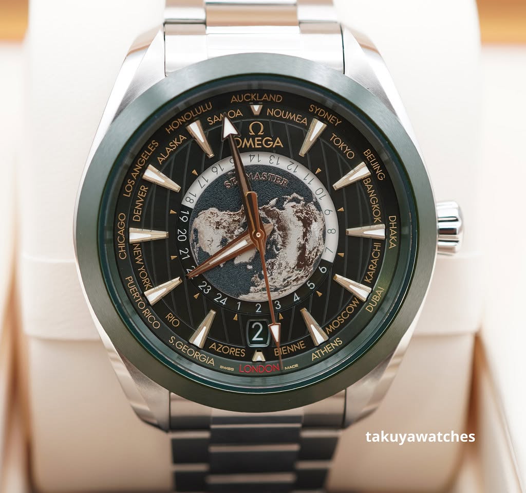 May be an image of wrist watch and text that says 'ALASKA SKA AL SA OA NOUMEA Ω DMEGA TEL 1L ει 20 MANIER 11 0ι ه TO OKYO 9L L 8 6 20 2 CHICAGO ထ ٢ 23 24 b BANGKO HAKA DAAKA…