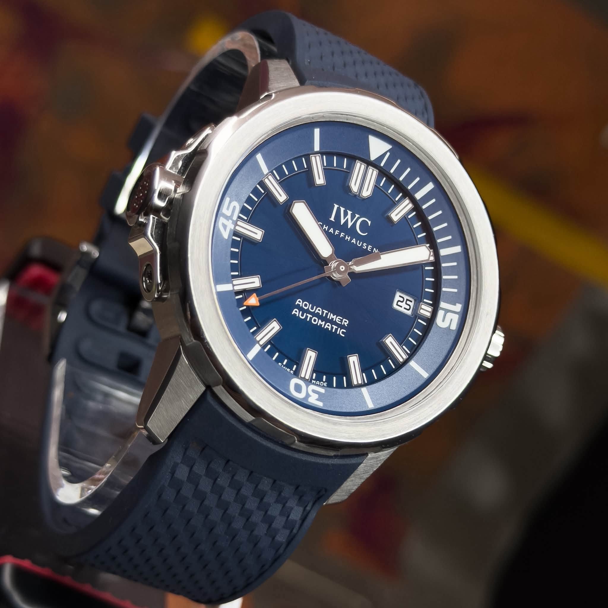 May be an image of digital watch and text that says '45 e የዮ HAF HA HAFFHAUSEN AUSEN e IWC FF FHA AE AUTO AQUAT AUTOMATIC TIMER O I| 5 0 SAD ADE'