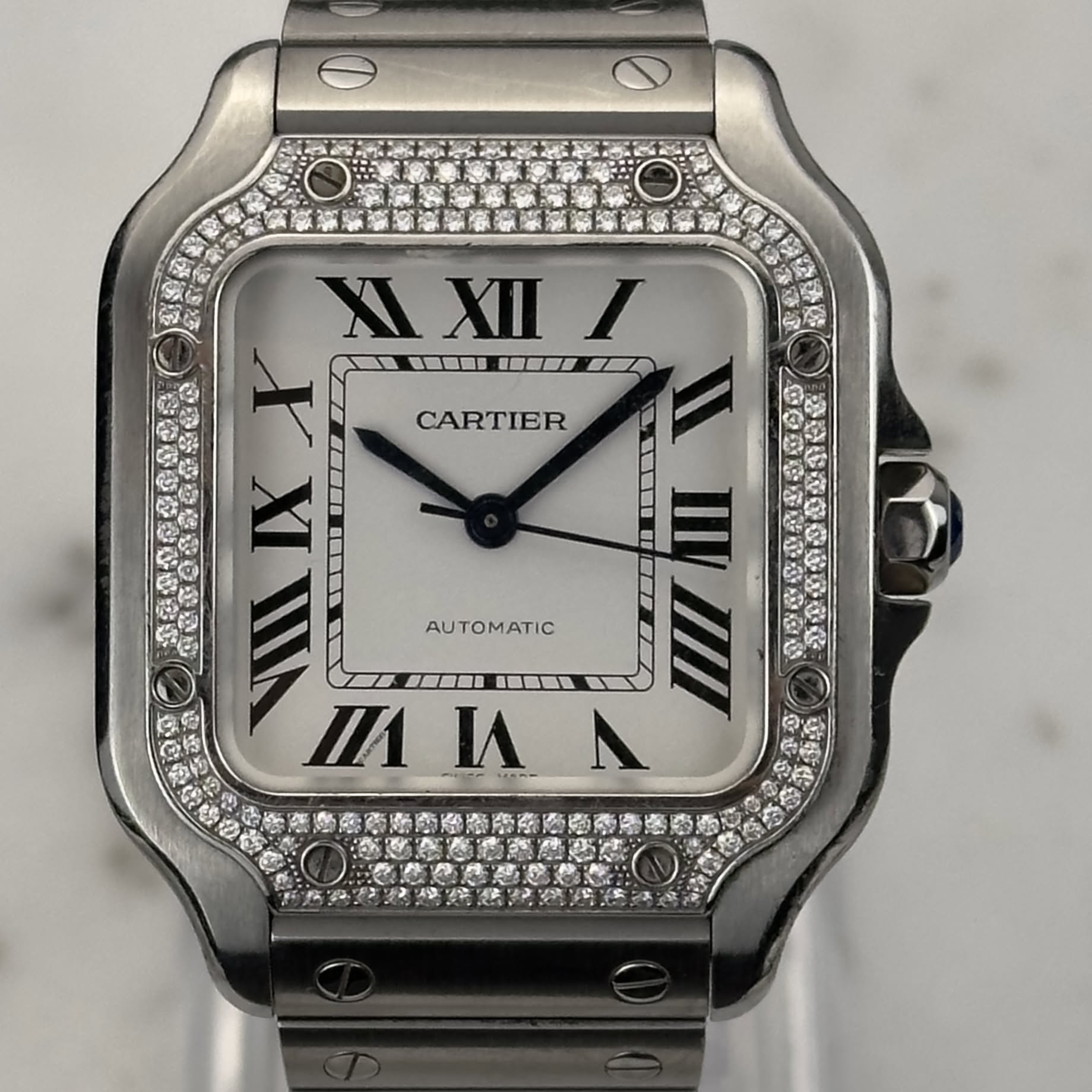May be an image of wrist watch and text