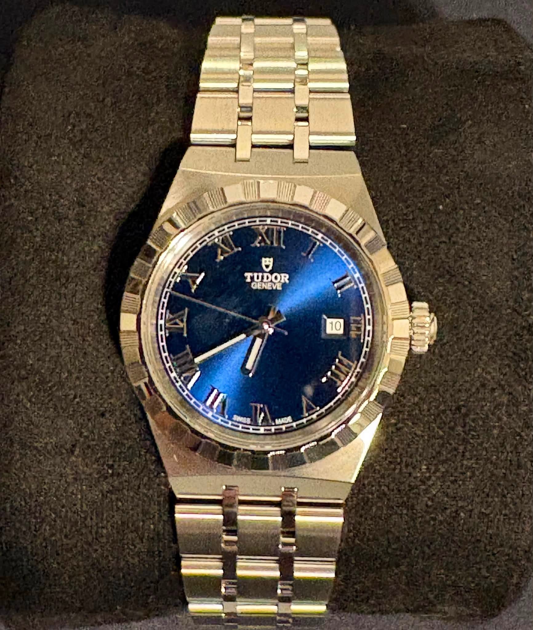 May be an image of wrist watch and text