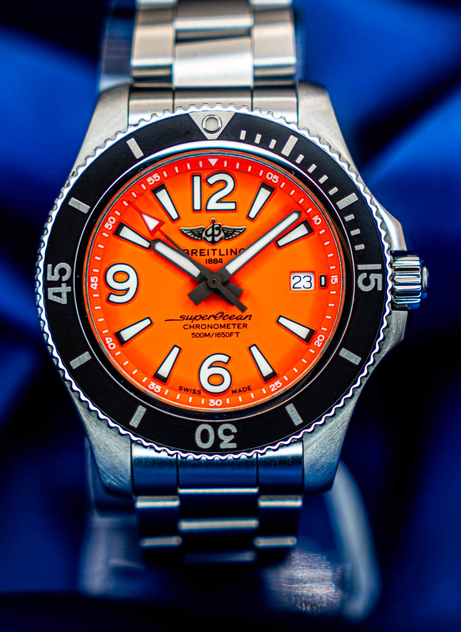 May be an image of wrist watch and text that says ' BREITLINO S 45 9 on I 5 15 superecean CHRONOMETER 500M/ 500M/1650FT SWISS 6 MADE 30 00 9'