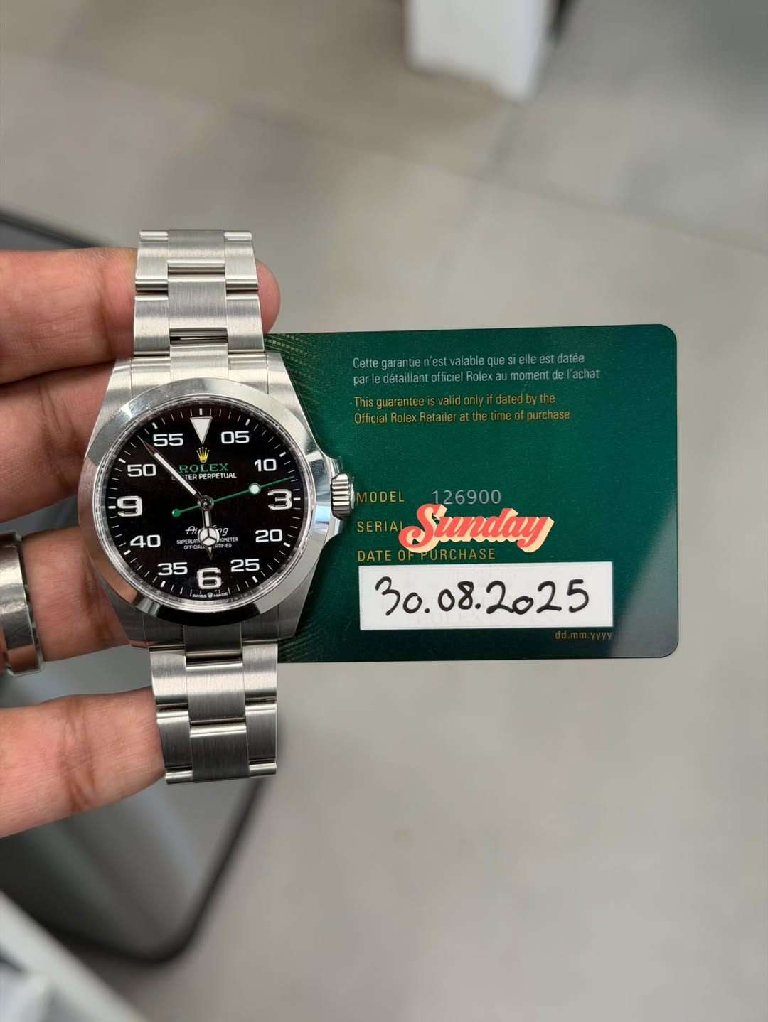 May be an image of wrist watch and text
