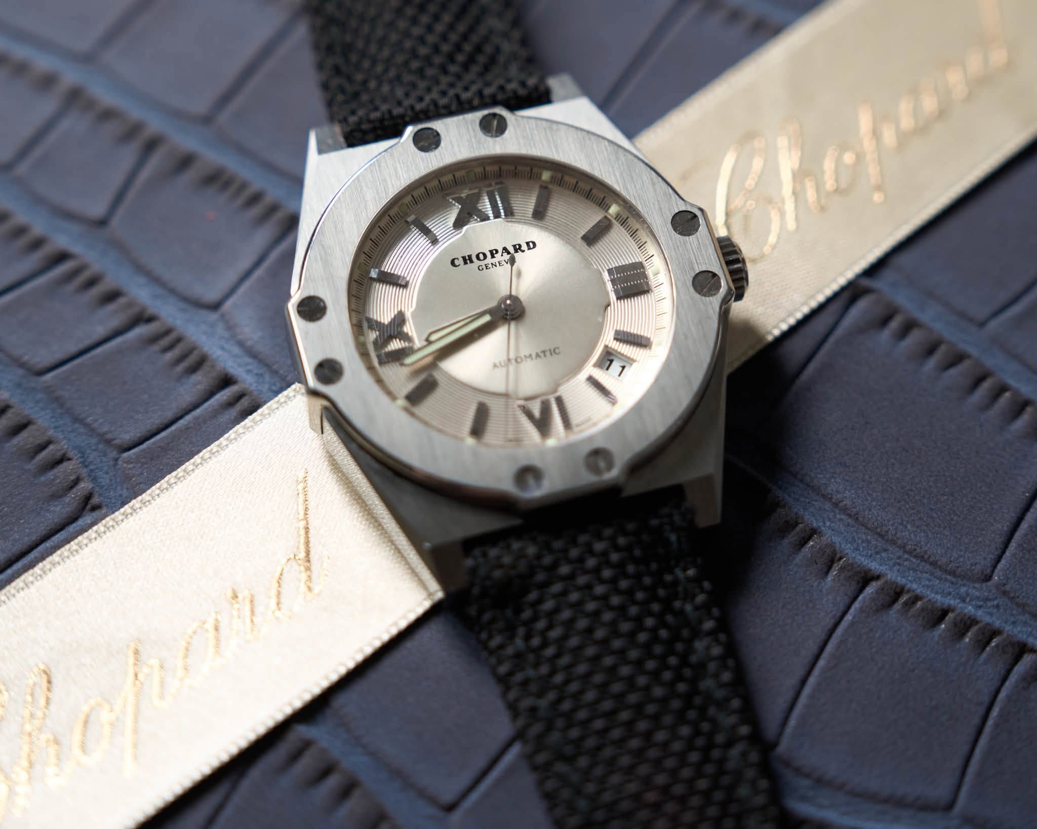 May be an image of wrist watch, leather and text