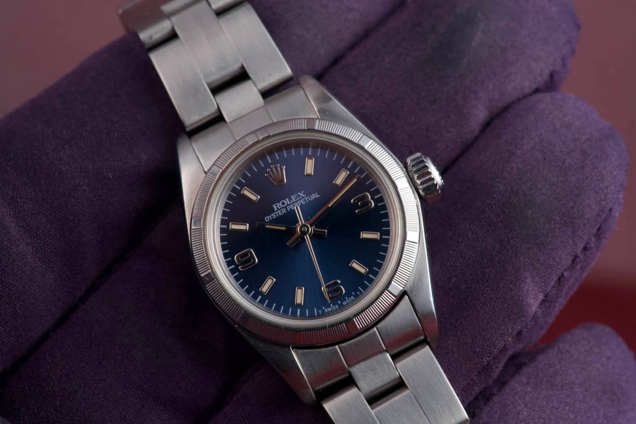 May be an image of wrist watch and text