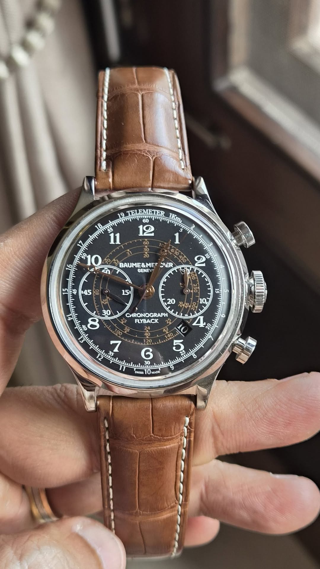 May be an image of wrist watch and text