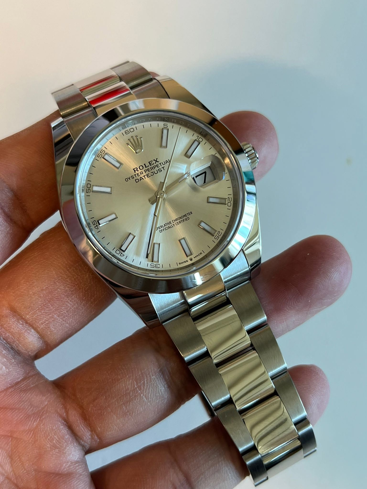 May be an image of wrist watch and text