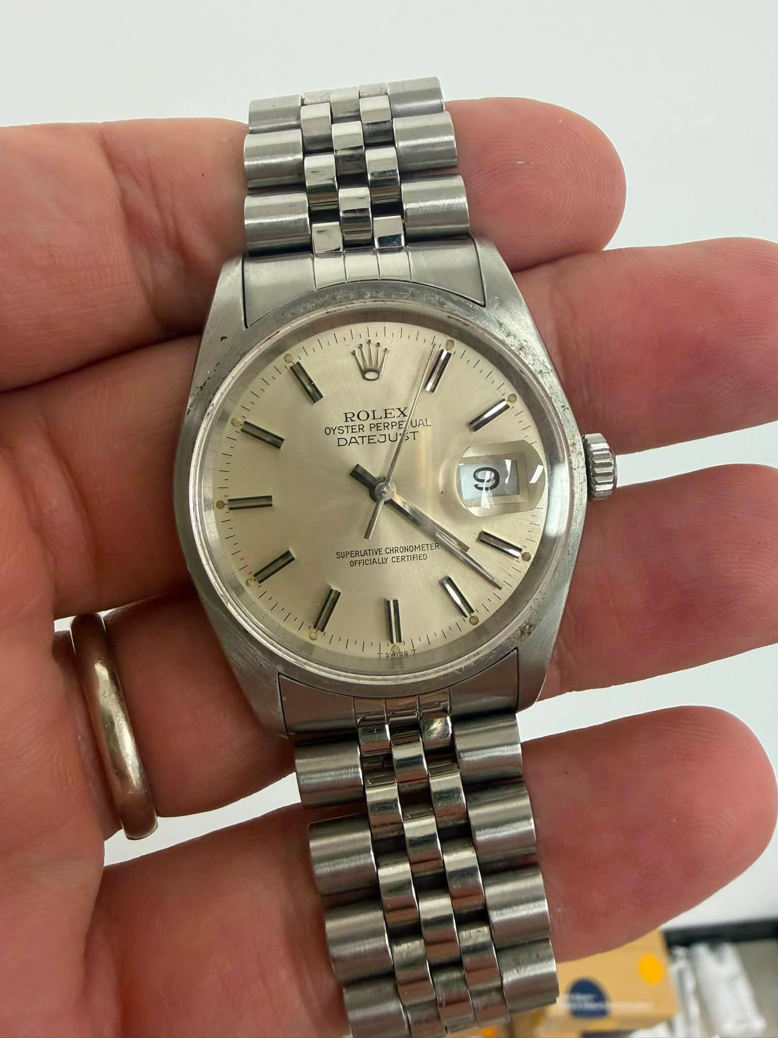 May be an image of wrist watch and text