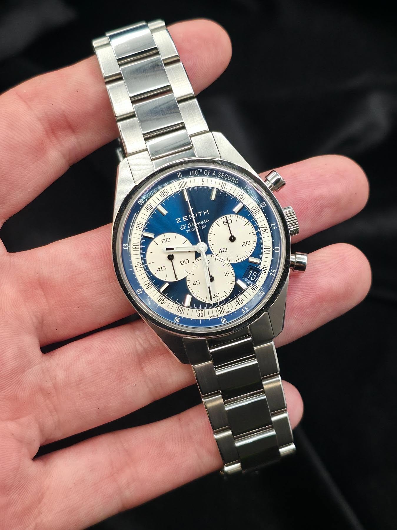 May be an image of wrist watch and text