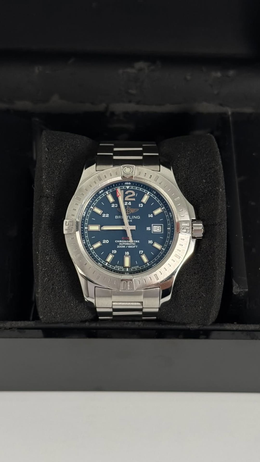 May be an image of wrist watch and text