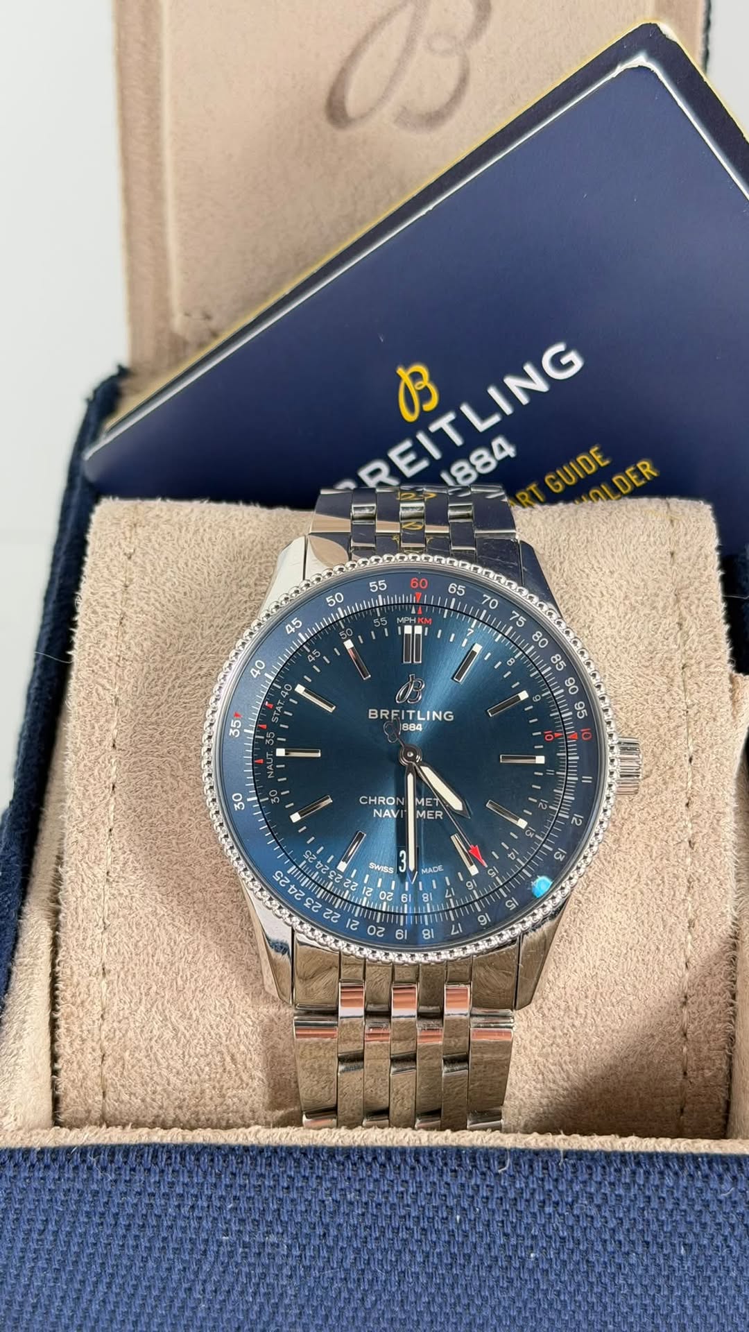 May be an image of wrist watch and text that says 'REITLING B 1884 GUIDE DER 果た思さい .」 40 70 75 LIL ul 80 35 BRF FITLING ING 90 かい 30 CHRO NAV MET MER 12 12 SAOESE MADE 02 사 g| BI'