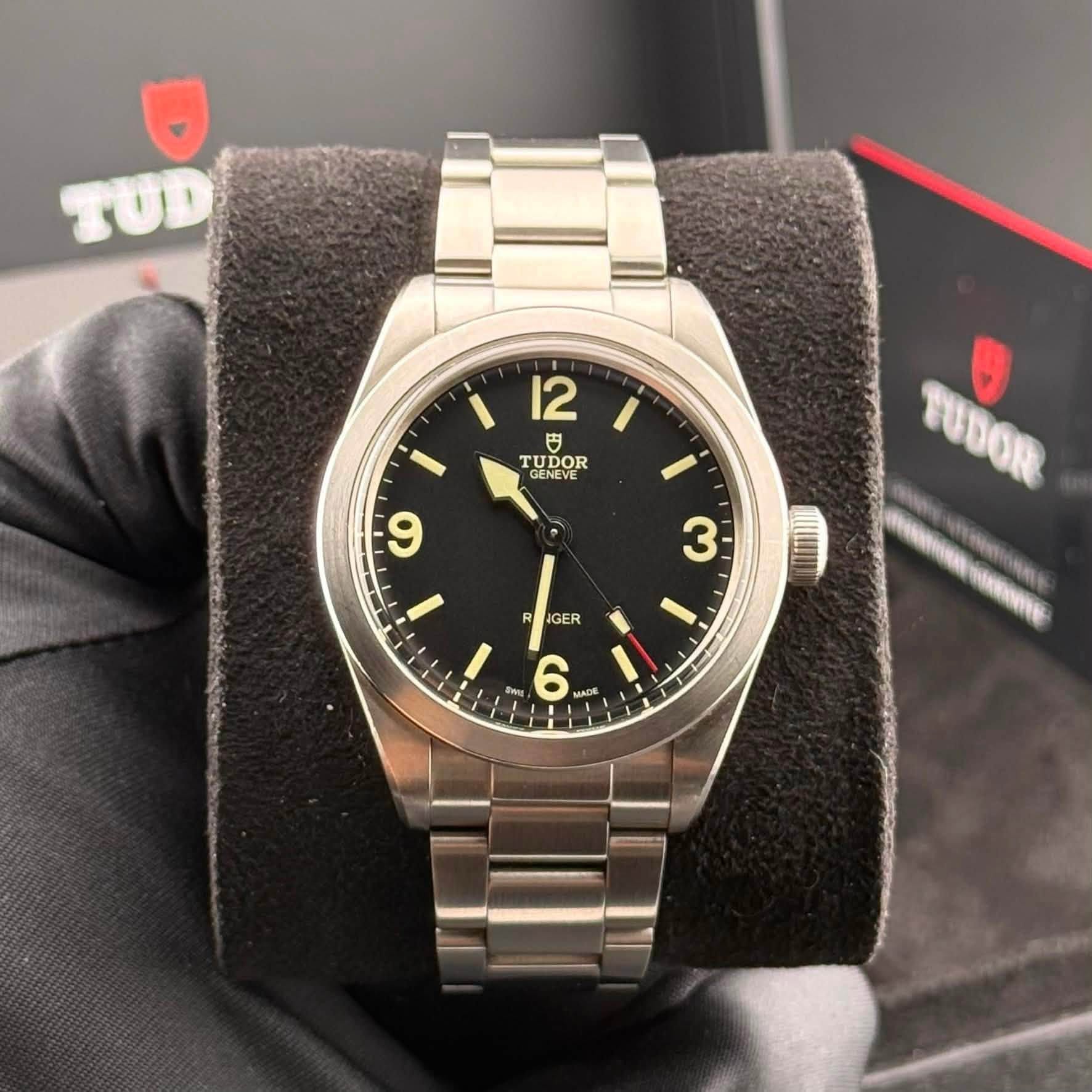 May be an image of wrist watch and text