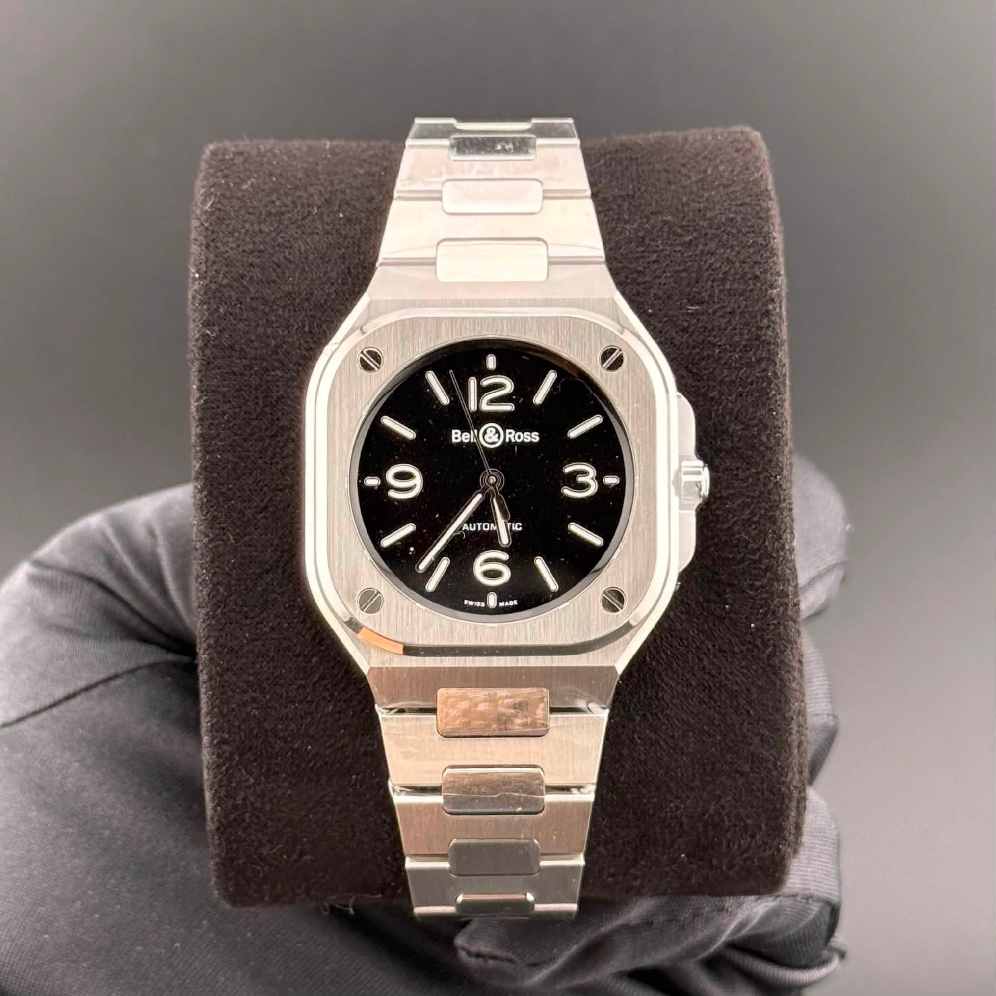 May be an image of wrist watch and text