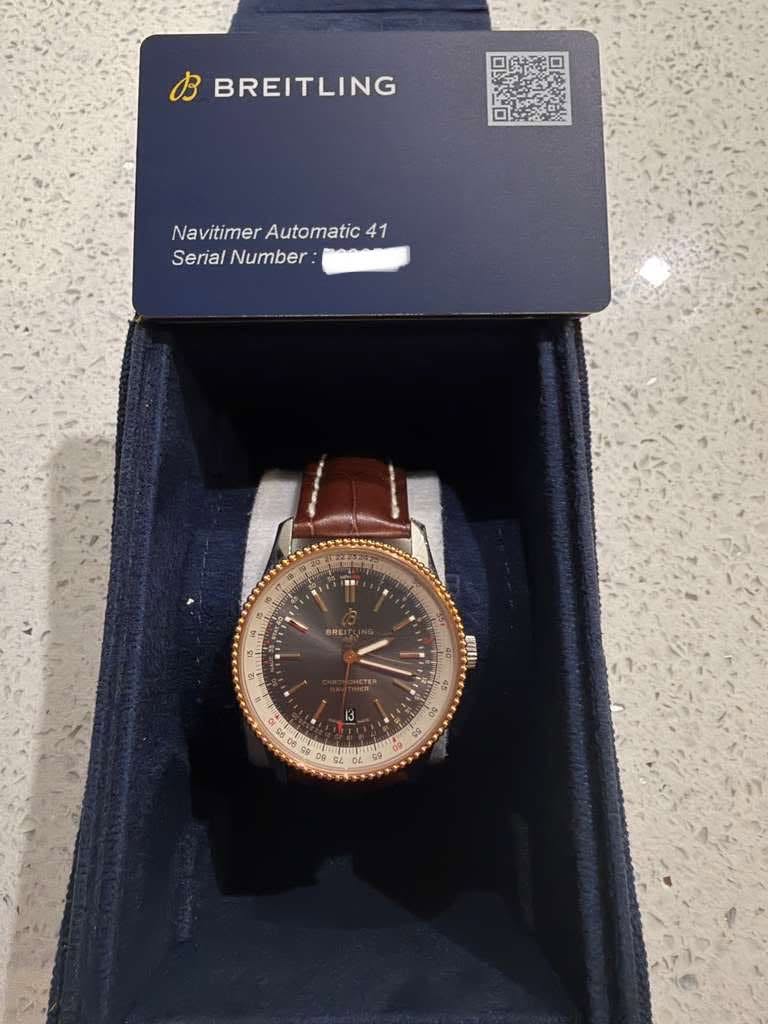 May be an image of wrist watch and text that says 'お BREITLING Navitimer Automatic NavitimerAutomatic 41 Serial SerialNumber Number: " ORE 即川 5'