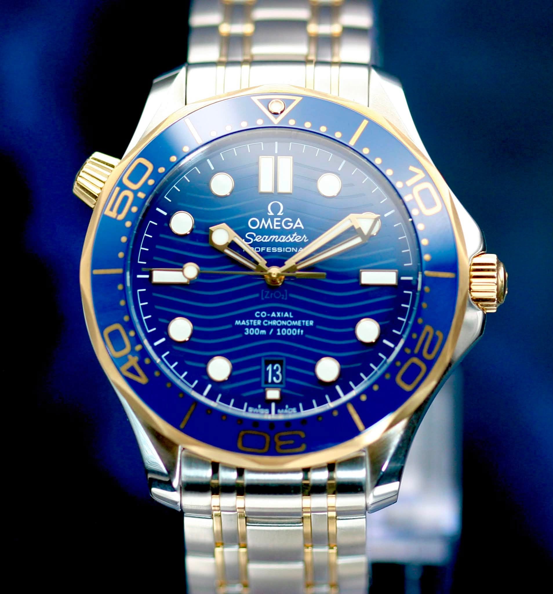May be an image of wrist watch and text that says 'I 10 ח OMEGA Seamaster OF OFESSION بف ب ل سل 0 جز 40 MASTE MASTENOOFTER cO- O-AXIAL CHRONOMET TER 300m 1000ft 13 မြ 20'