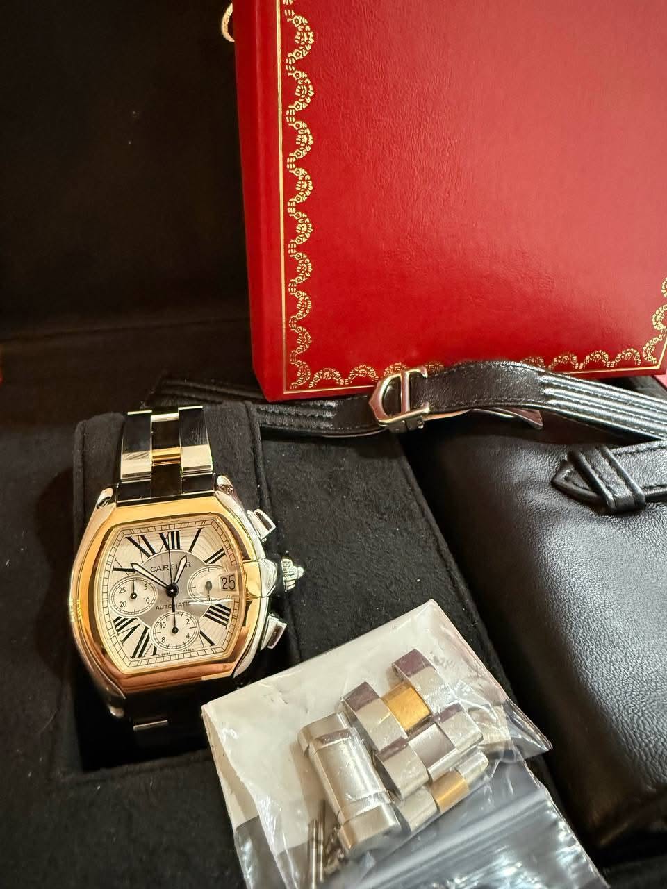 May be an image of wrist watch and text