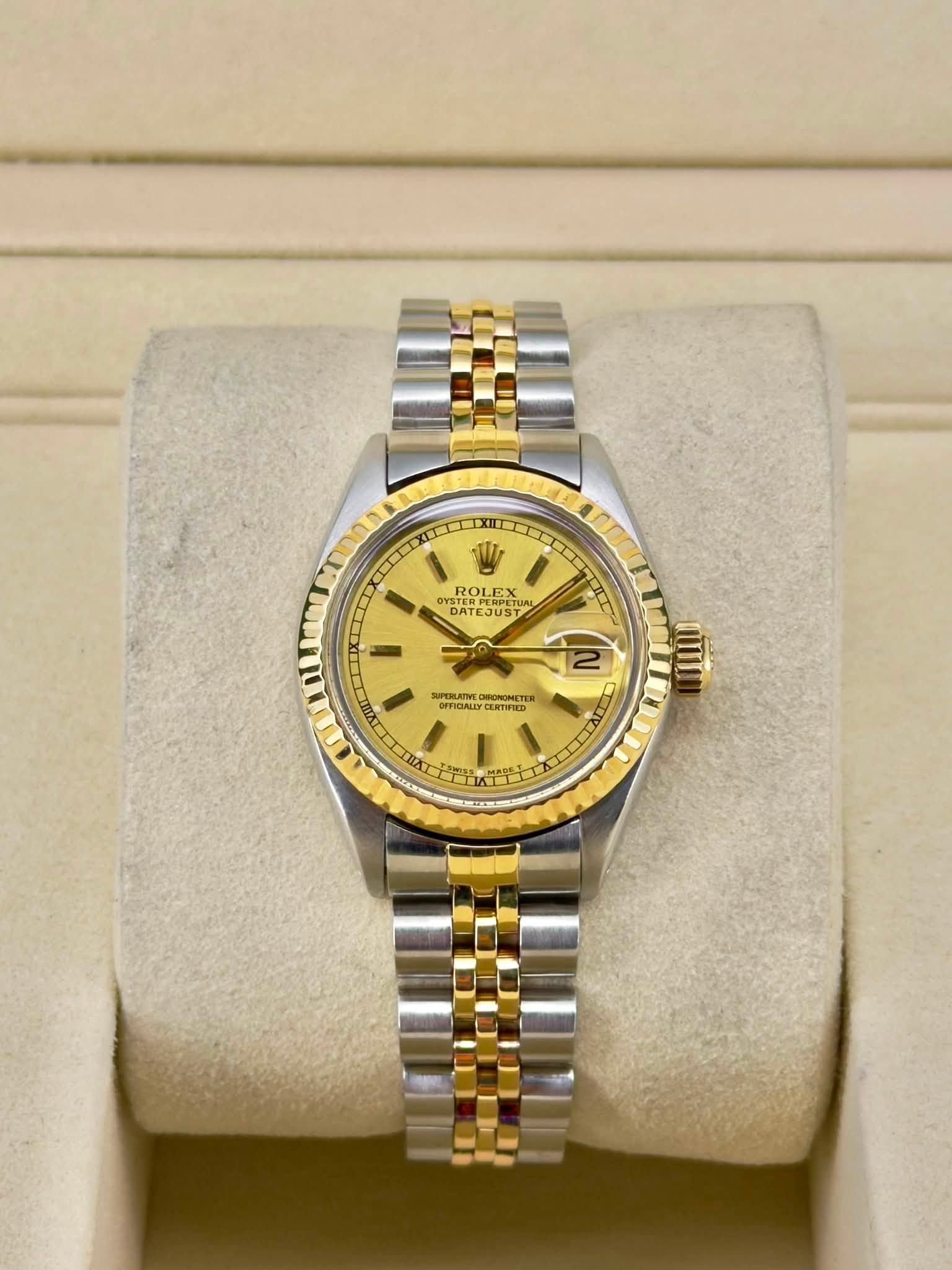 May be an image of wrist watch and text