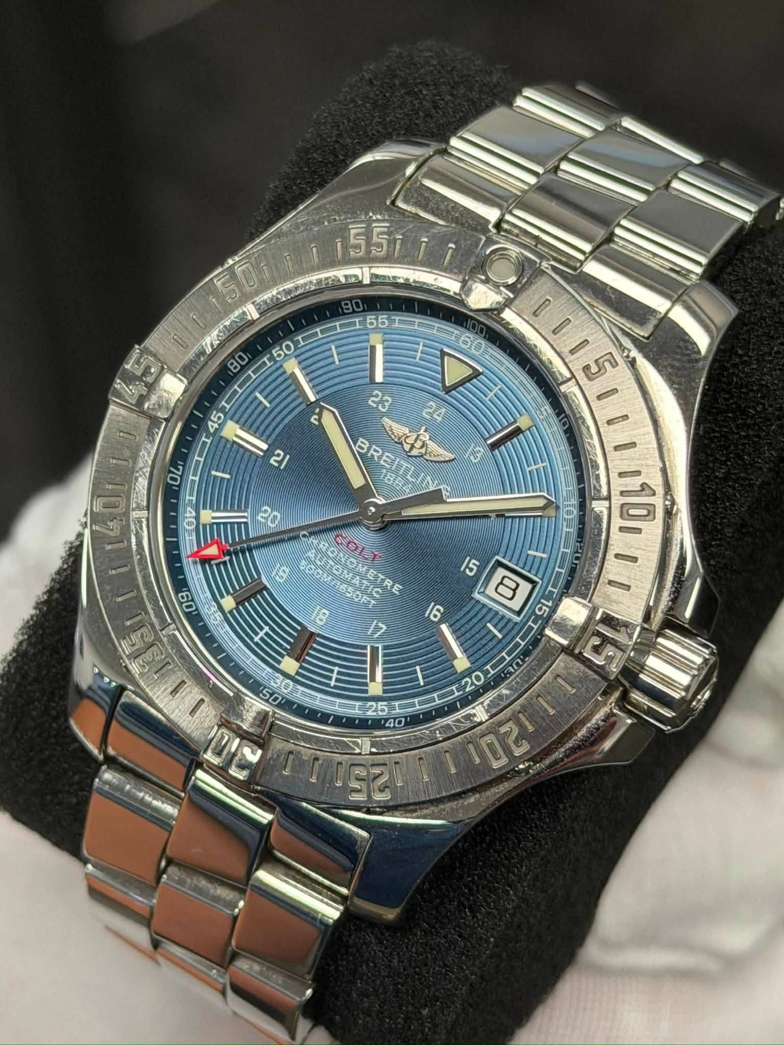 May be an image of wrist watch and text