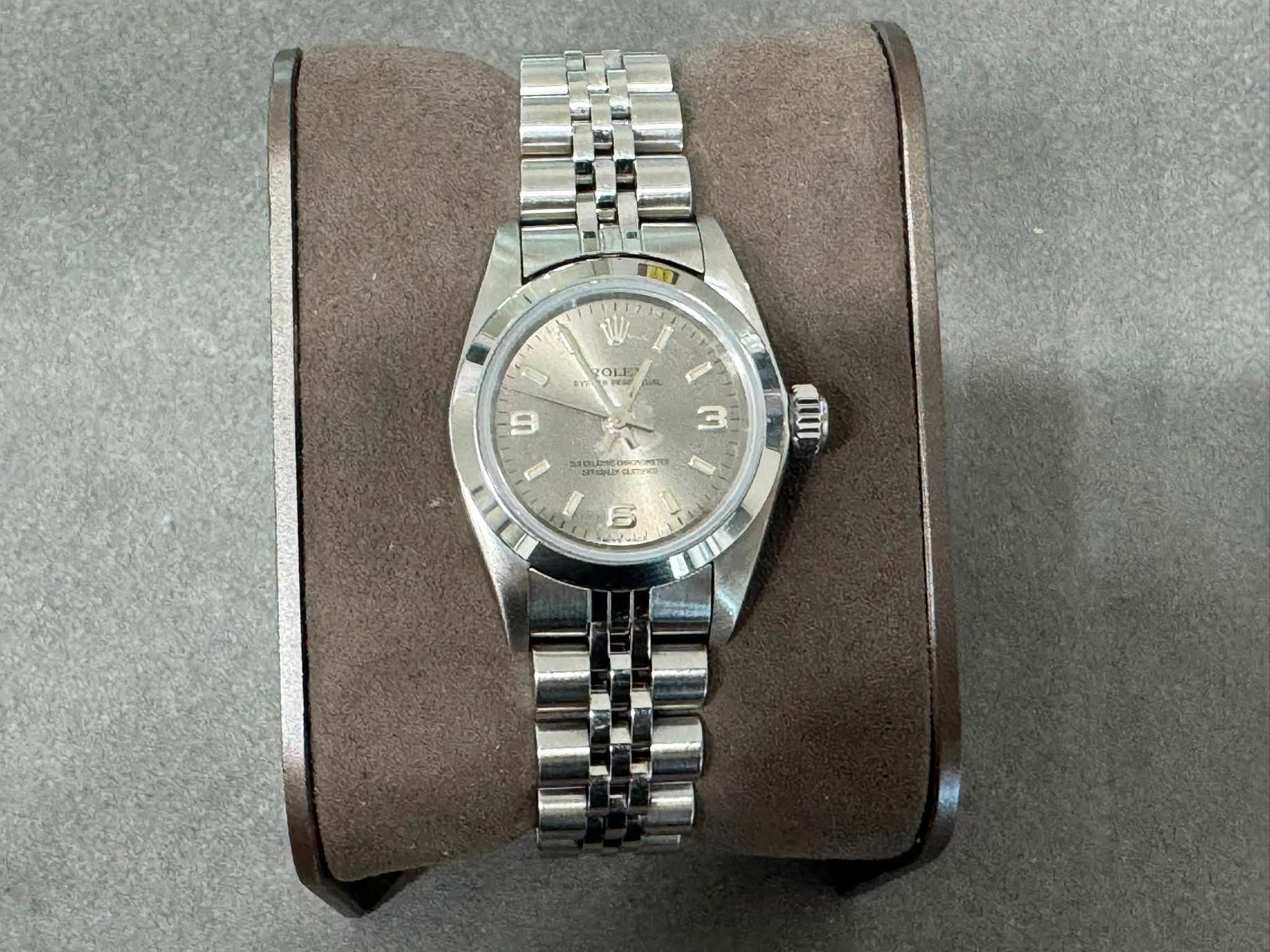 May be an image of wrist watch and text