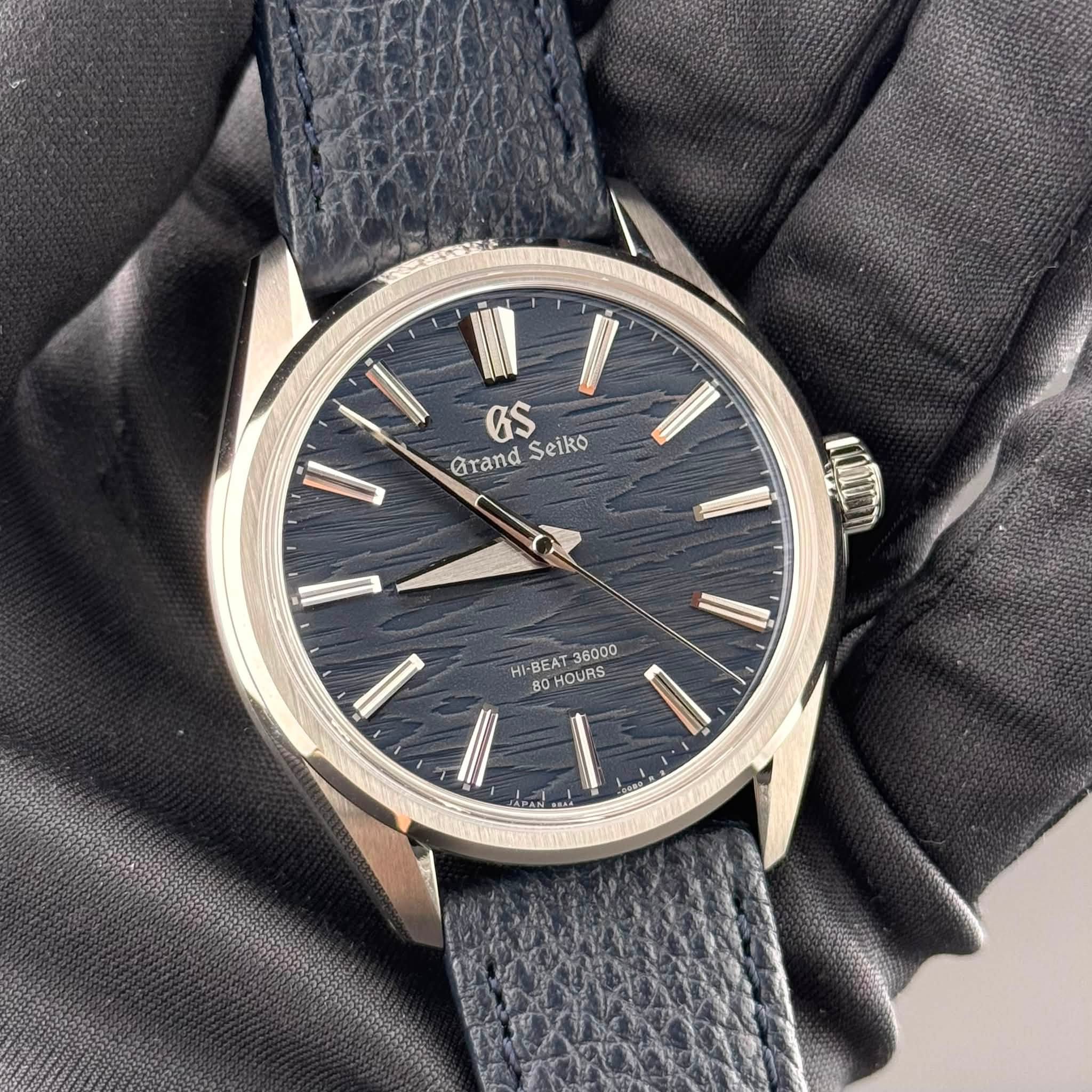 May be an image of leather, wrist watch and text that says 'Grand GS Seiko 36000 HI HI-BEAT HOURS BO N'