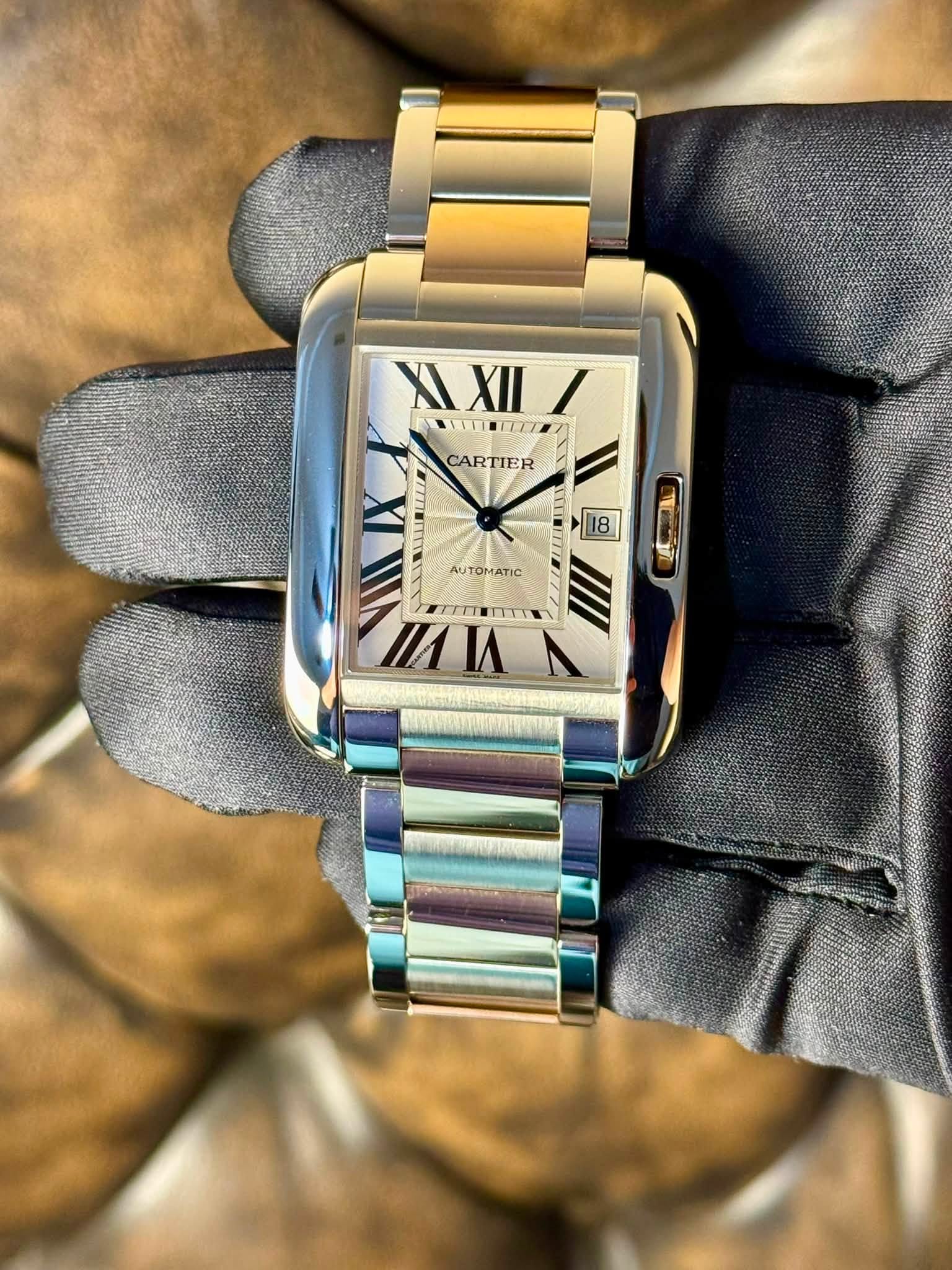 May be an image of wrist watch and text