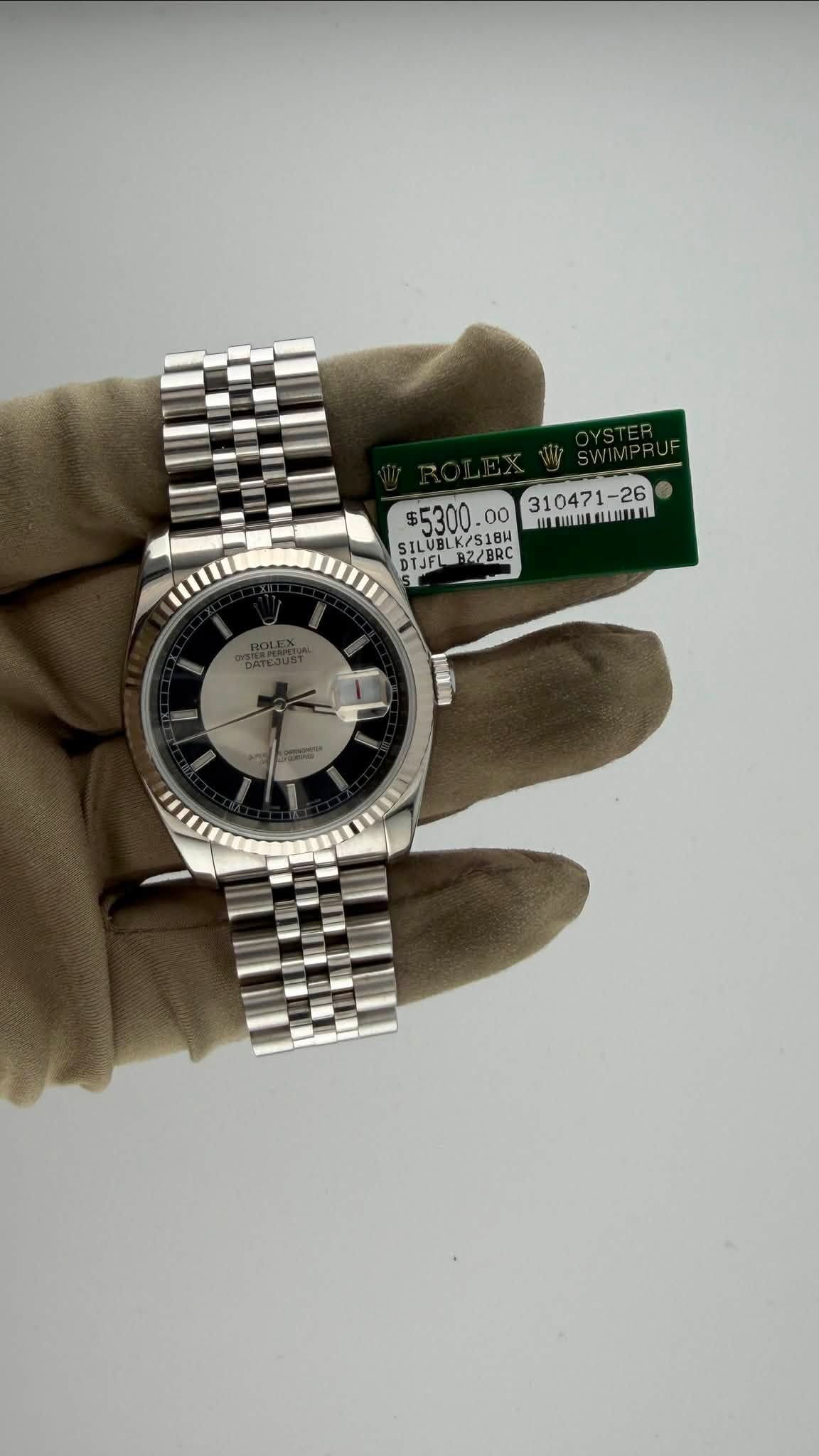 May be an image of wrist watch and text that says '$5300. SILUBLK/S1BH SK/S18 SILUBL LK/S18H 118H DTJFL B DTJFLBZZERL Z/BRC ZBR T'