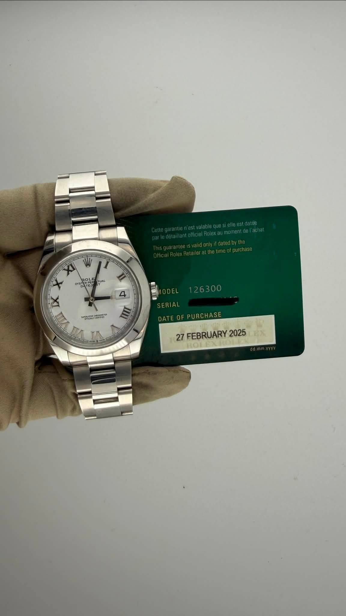 May be an image of wrist watch and text that says 'တအညတ၁ T ON שפרה וסי TLN Ii 4 d ኢዮ RA ERIAL DATE DATEOFPURCHASE ド RCHASE 27 FEBRUARY2025 2025B eЖ FEBRUARY 2025'