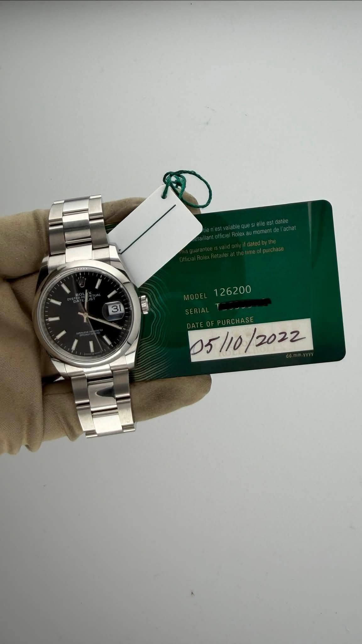 May be an image of wrist watch and text