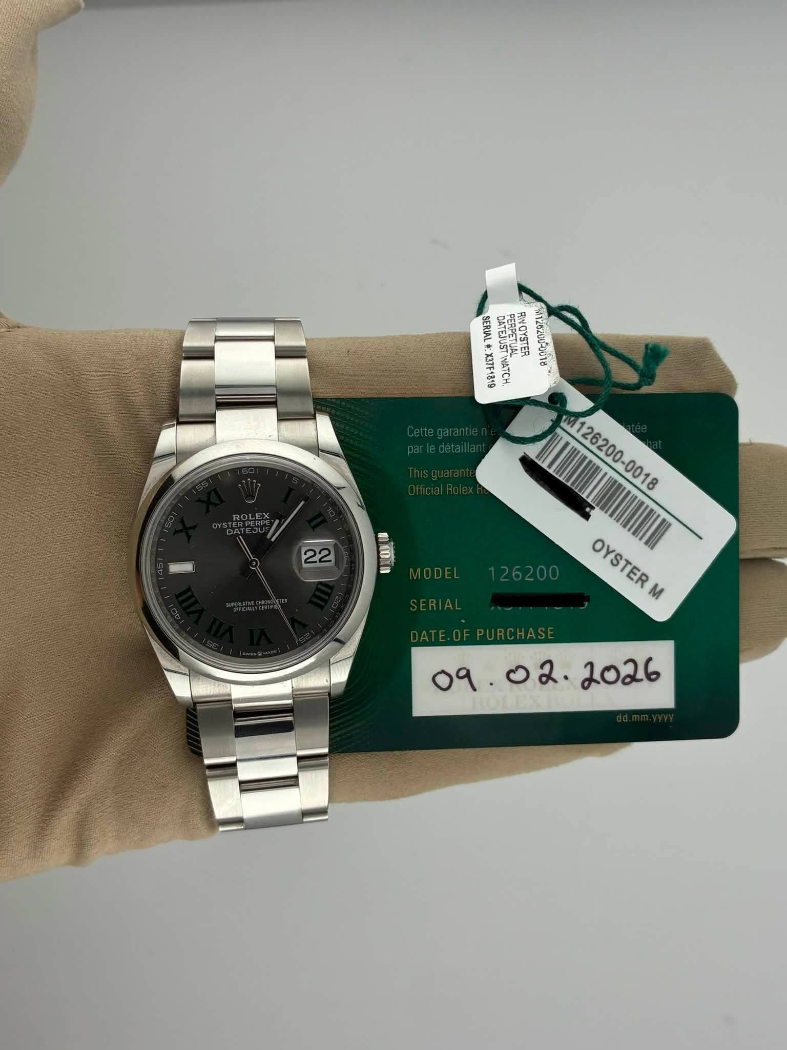 May be an image of wrist watch and text