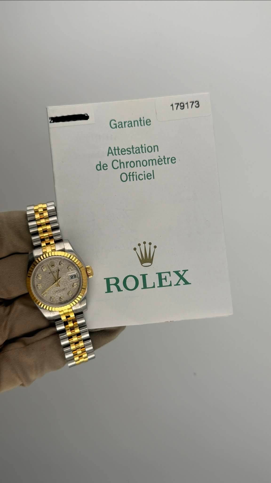 May be an image of wrist watch and text that says '179173 Garantie Attestation de Chronomètre Officiel 13 ENI ROLEX'