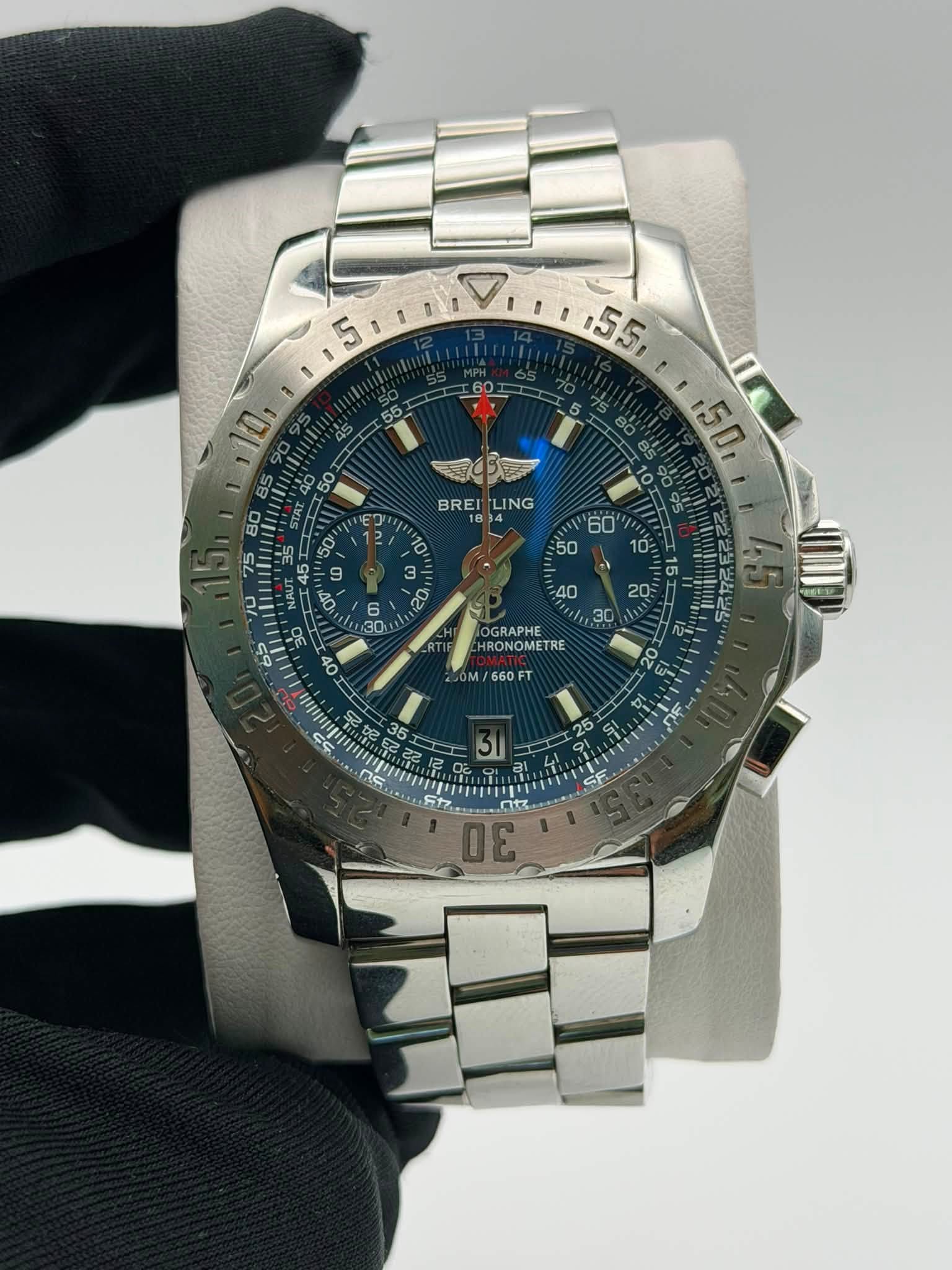 May be an image of wrist watch and text that says '5 ነ100 ,55, 150, BREI BREILING LING 4 7วั 3 6 60' 50 10: GRAPHE RONOMETRE /660 660FT CF 25 51 ai 30'