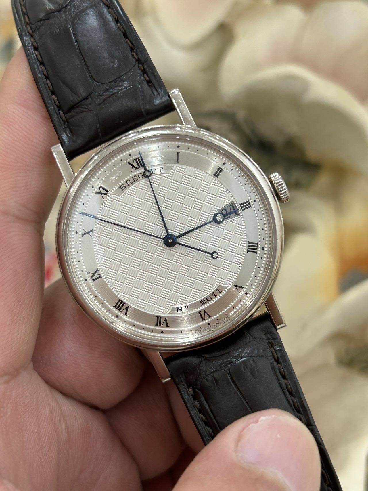 May be an image of wrist watch and text