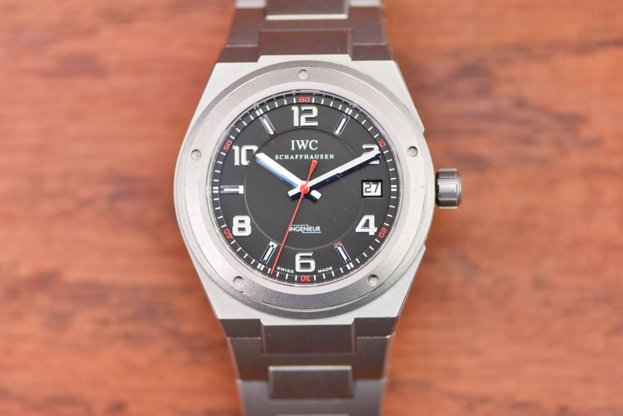 May be an image of wrist watch and text that says '" Ο 50 1ና IWC SCHAFFHAUSEN HAUSEN 10 10 NGENIEUR 27 4 O 8 II i ) WISS 6 ADE AD DE 1 C'