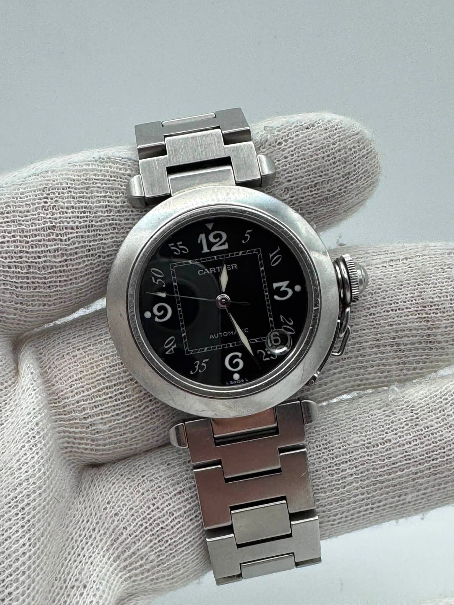 May be an image of wrist watch and text