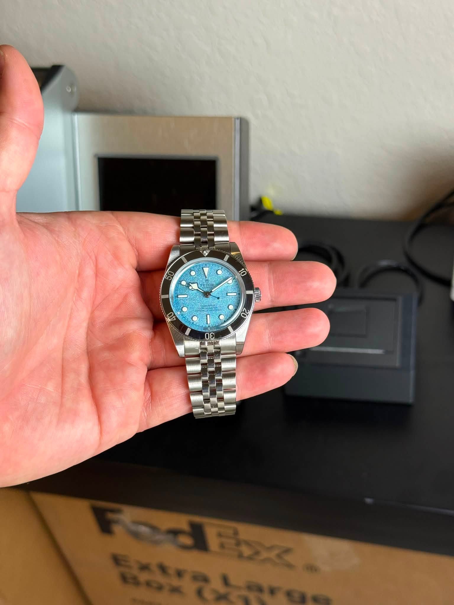 May be an image of wrist watch and text