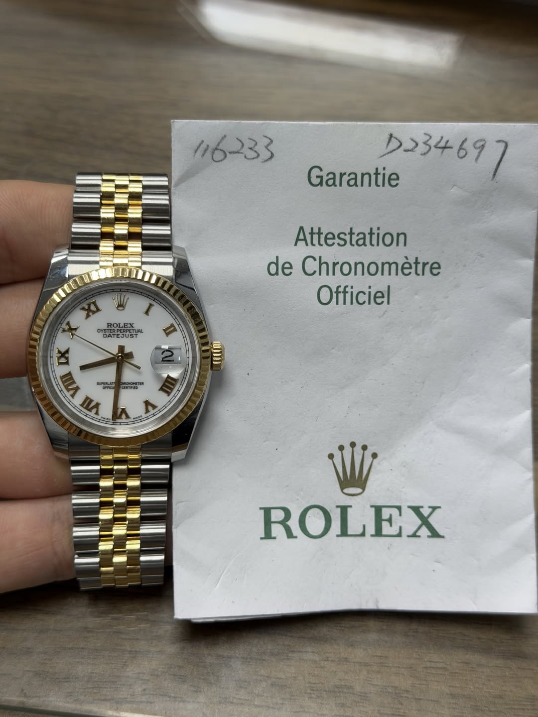 May be an image of wrist watch and text that says '116233 Garantie クレ34697 Attestation de Chronomètre Officiel oy BATEJUST STERPERPETU HOLEX ATEJUST II 取 DX VII SO PE কলান VII মর্ত…