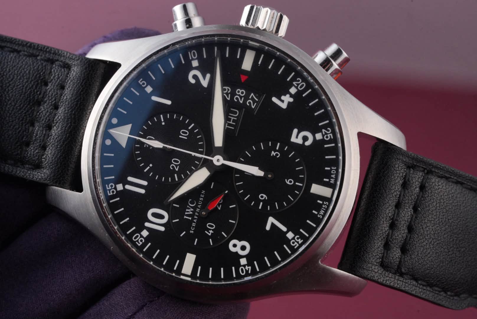 May be an image of wrist watch and text