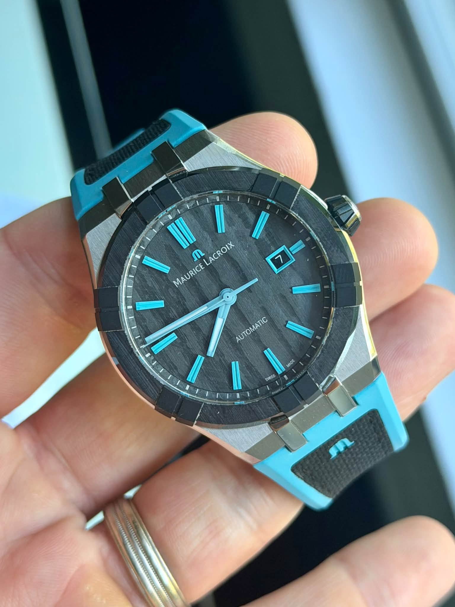 May be an image of digital watch and text that says 'ጢ ACROIX MAURICE 7 AUTOMATIC'
