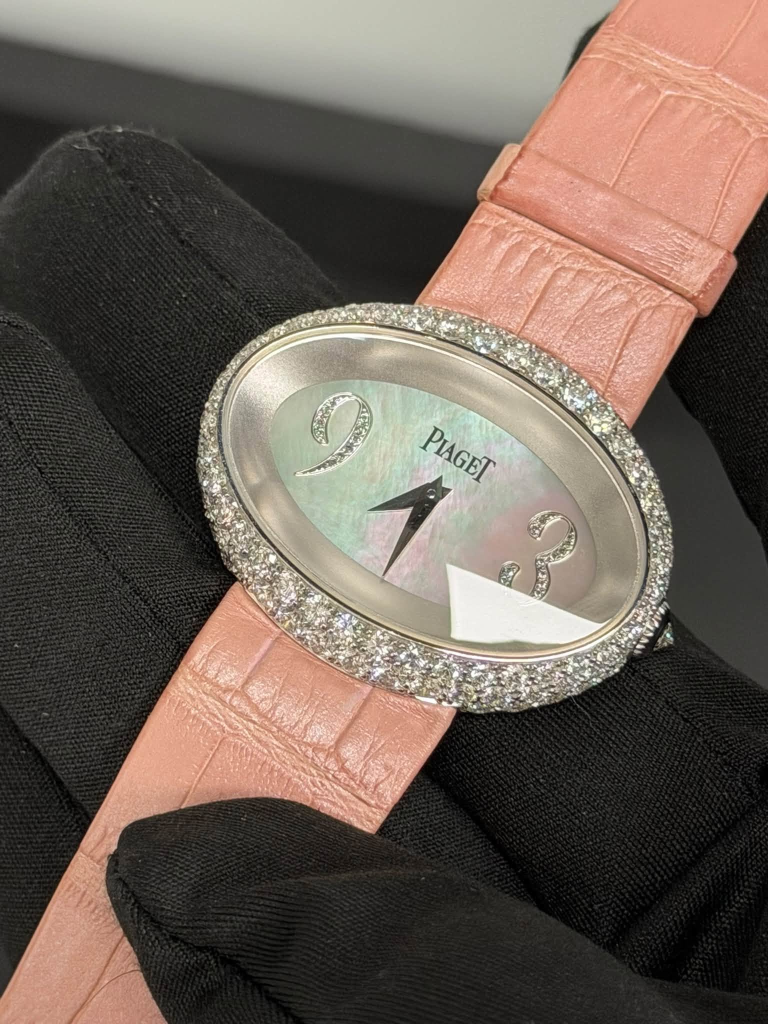 May be an image of wrist watch and text