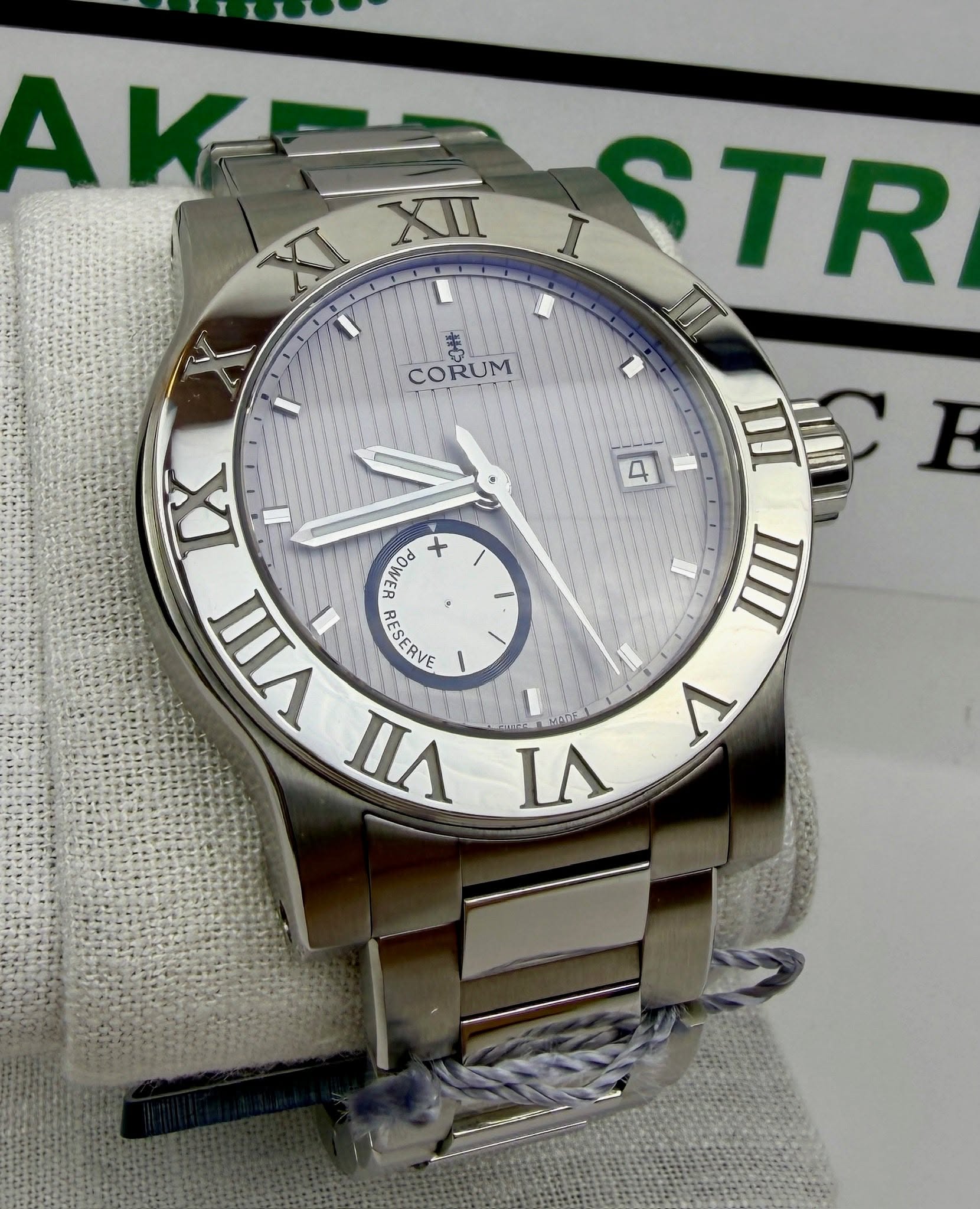 May be an image of wrist watch and text that says 'V AKE ROSTR I XII STR ......... IT $ CORUM 4 IIII E I XI POMON + II u 1I WΛ ESERY RESERVE CRVE ١ nA S 1 V'