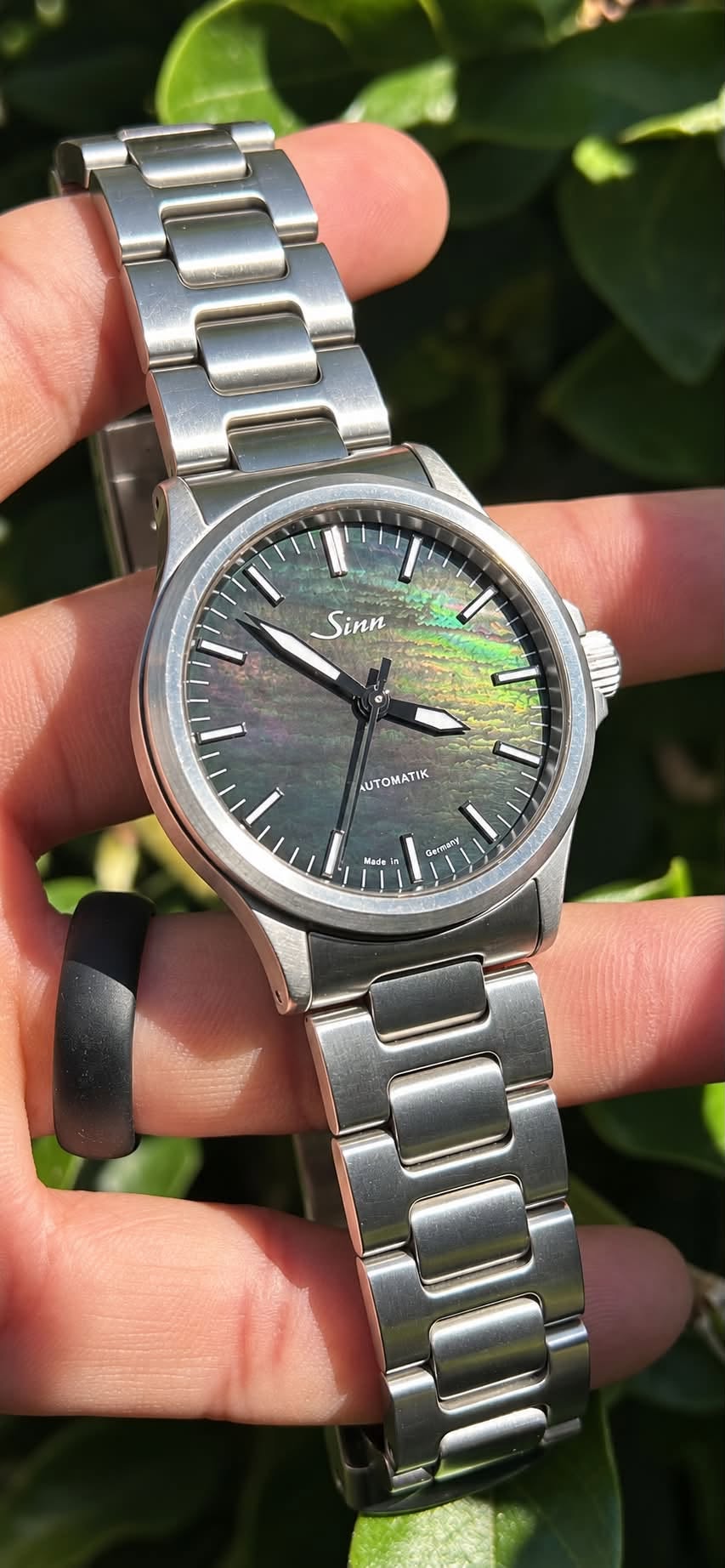 May be an image of wrist watch and text that says 'l' Sinn AUTOMATIK kade MPO /'