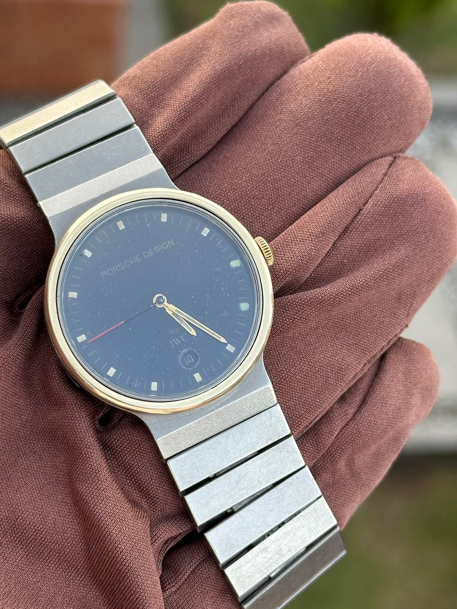 May be an image of wrist watch and text that says 'PORSCHE DESIGN PORSCHE Ne 14'